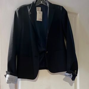 Gap navy blazer with striped lining in the sleeves.